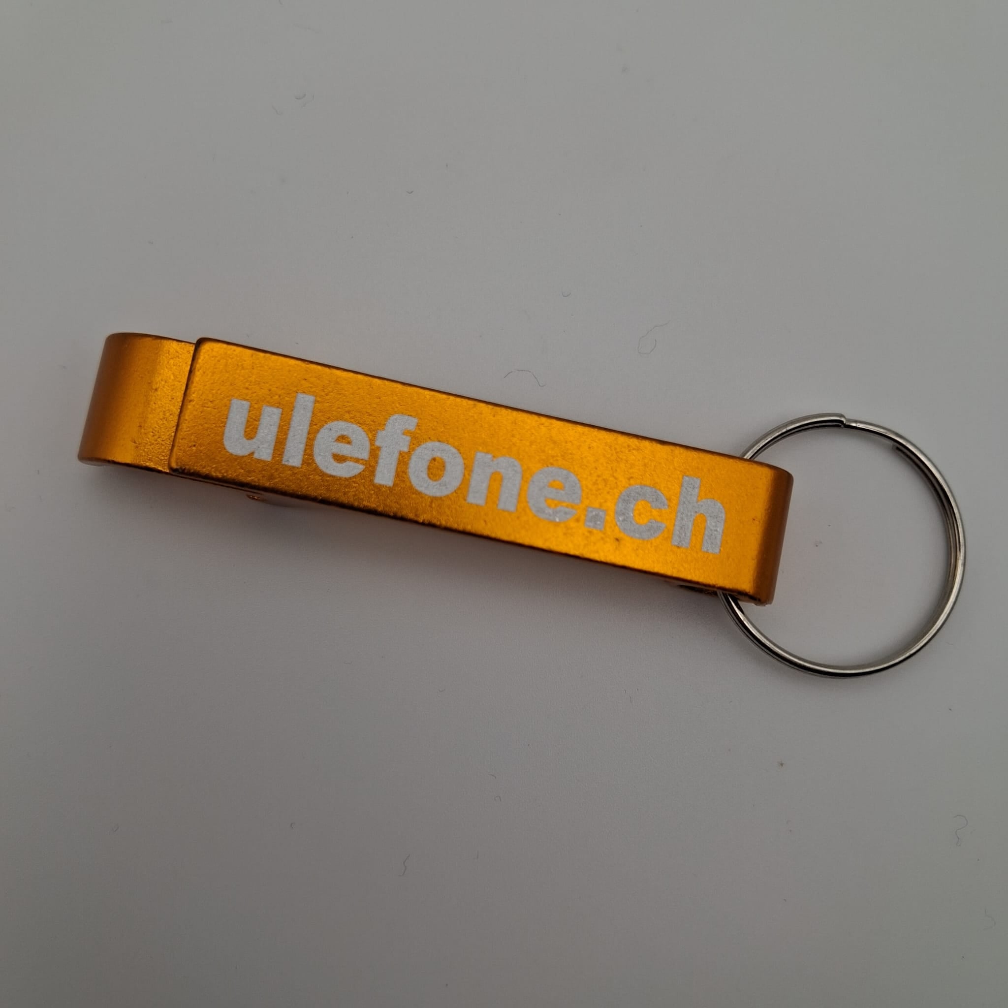 Ulefone Flaschenöffner mit dem Schriftzug ulefone.ch in Gold Elektroniktrade Switzerland